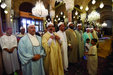 Tunisians dress in new clothes and visit friends and relatives on Eid