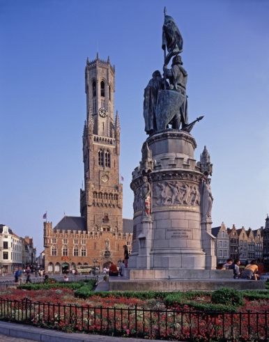 Statue of Belgian heroes, Jan Breydel and Pieter de Coninck, with the 83-meter high belfry in the background